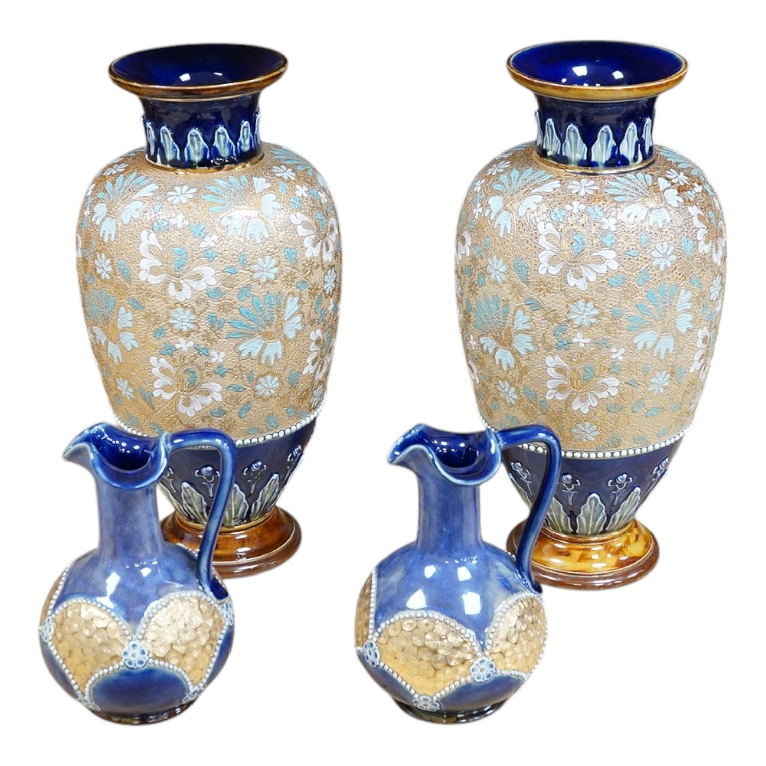 A pair of Doulton stoneware floral vases and a pair of similar jugs, largest 36cm high. Condition - good